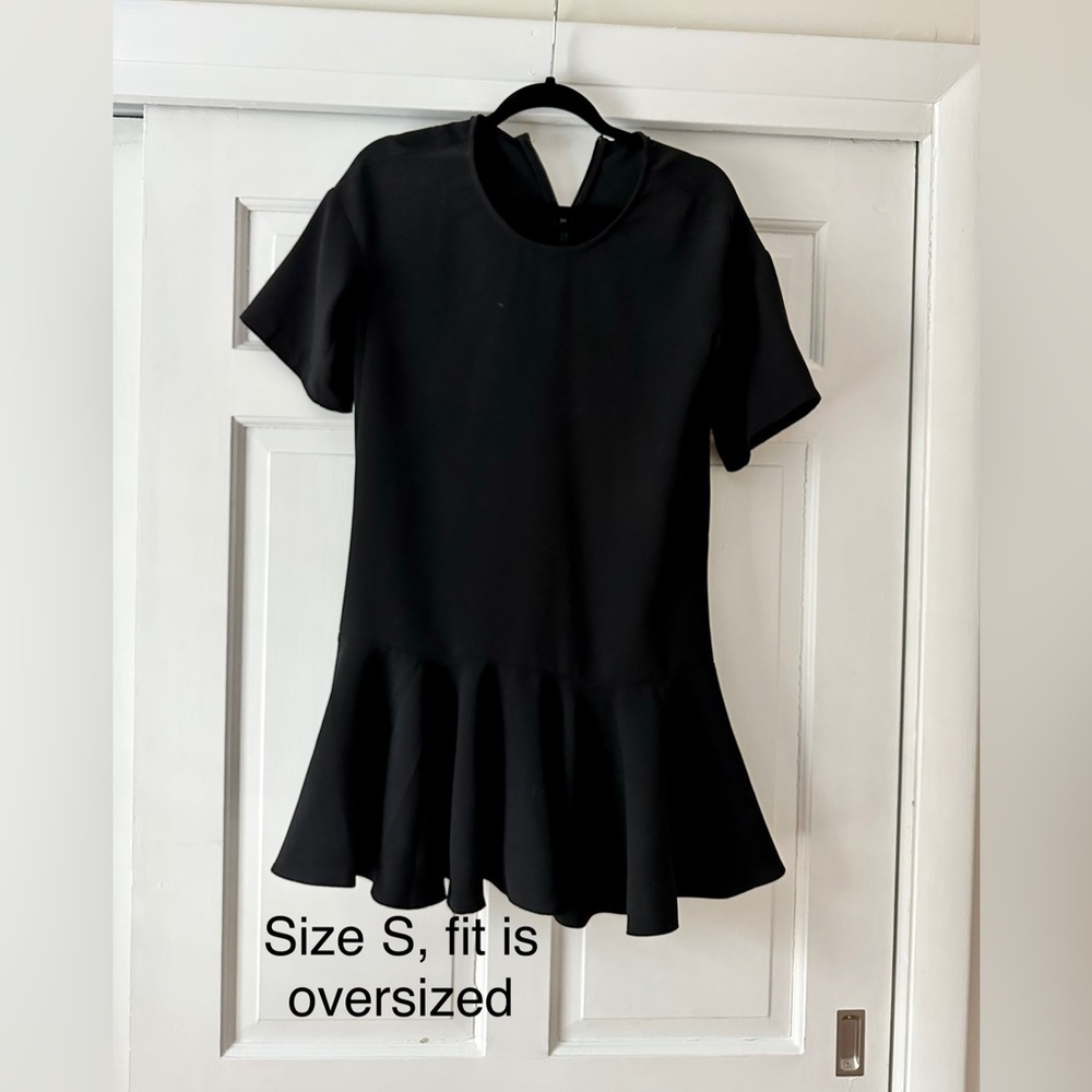 Black boutique dress, ruffle bottom, hits right above the knee